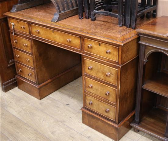 A reproduction pollard oak twin pedestal desk W.121cm